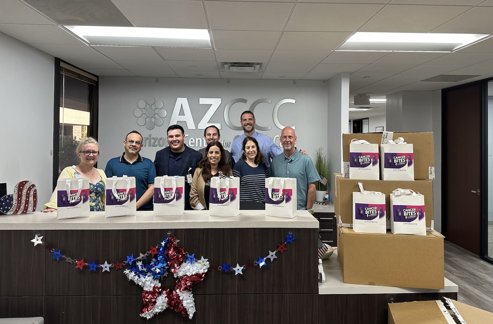 Arizona Center for Cancer Care staff receiving Cancer Bites gift bags